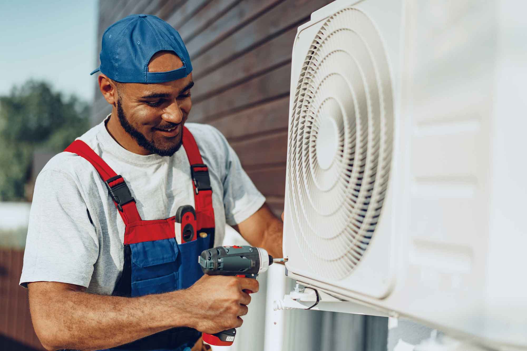 a technician fastening screws on HVAC